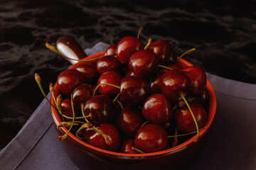 cherries in dark bowl