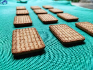 Biscuits isolated on light green background