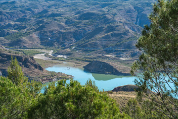 Beninar reservoir between mountains