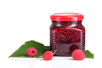Raspberry jam in a jar and fresh raspberries isolated on white background