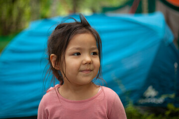 Girl 4 years old in the forest. Little girl of Asian appearance