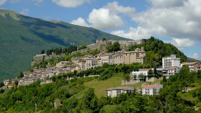 Italy 2020: View of Civitella del Tronto, built on a hill, on a warm but cloudy summer day. July 2020, Teramo