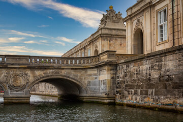 Photo of Copenhagen tourist landmark spot taken during a boat ride across the city canals, on a hot summer day with bright sky.