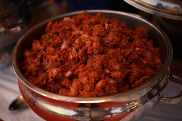 South Indian dish spicy beef fry Kerala, India. side dish ghee rice, appam, parotta, puttu, bread and chappathi, Kerala cuisine ,Buffalo roast / Meat pepper fry with coconut. India spices cooking,