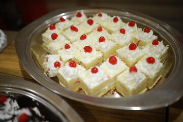 Indian reception wedding cake with roses and donuts.Beautiful wedding cake in Romantic styles.