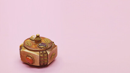 copper box for jewelry, on pink background