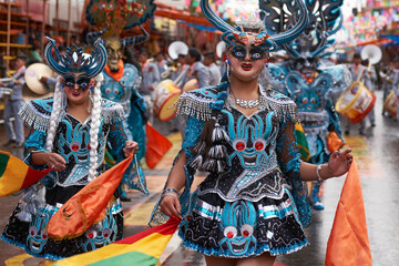 Diablada dancers in ornate costumes parade through the mining city of Oruro on the Altiplano of...