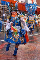 Wall murals Carnival Diablada dancers in ornate costumes parade through the mining city of Oruro on the Altiplano of Bolivia during the annual carnival.
