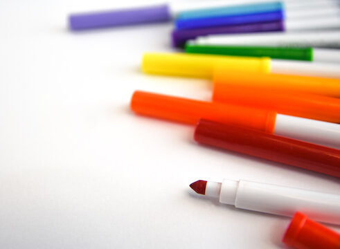 colored markers on a white background 