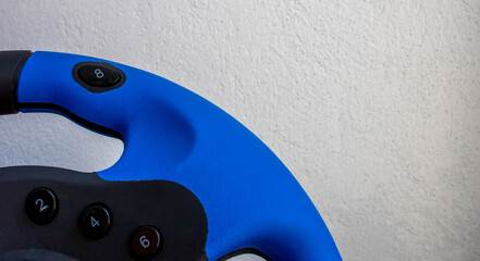 Computer blue steering wheel. Isolated on a white background.