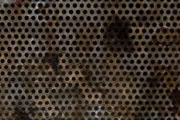 Perforated metal sheet. Rusty metal texture with perforated holes metal corroded texture, rusty metal background