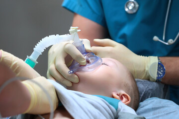 Preparing a child for dental surgery. General anesthesia. Treatment of multiple caries of baby teeth. Copy of the space. - obrazy, fototapety, plakaty