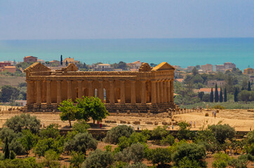 View of ancient greek Temple of Concordia with sea view - Valle dei Templi, Agrigento, Sicily, Italy