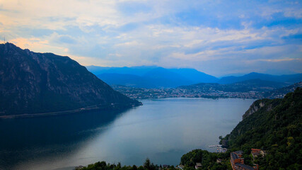 Aerial view over the Lake Lugano in Switzerland - evening view - drone footage