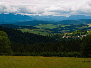 Fototapeta na wymiar The view of Tatras from Majerz pasture. Pieniny National Park. Czorsztyn. Poland