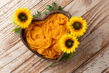 Heart made of wood, painted with sunflowers. basket for a newborn photo shoot. sunflower yellow flower . heart