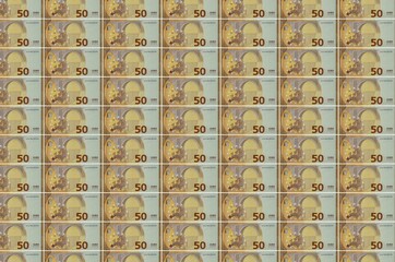 50 euro bills printed in money production conveyor. Collage of many bills. Concept of currency...