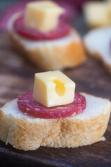 cheese platter with cold cuts and homemade bread to enjoy as a family with a cold drink