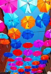 Fototapeta na wymiar hanging umbrellas in the city