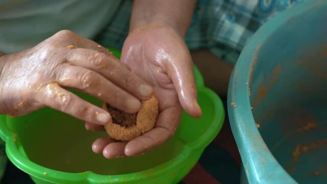 Traditional Turkish Food; Stuffed Meatballs, Turkish known as "icli kofte". Woman making Stuffed Meatballs at home.