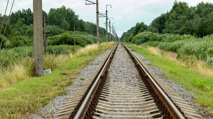 Fototapeta na wymiar a straight railway that goes off into the distance
