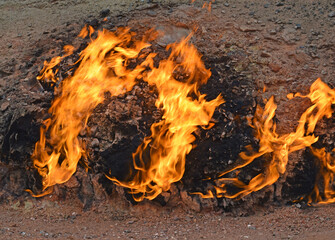 View of fire on a rock