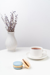 macarons on background Cup and vase with lavender.