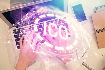 Double exposure of woman hands working on computer and blockchain theme hologram drawing. Top View....