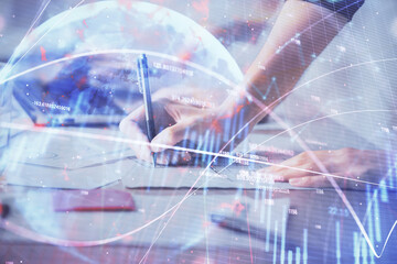 Multi exposure of woman hands typing on computer and financial chart hologram drawing. Stock market analysis concept.