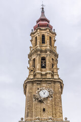 Fototapeta na wymiar Bell tower of Savior Cathedral (Catedral del Salvador or Cathedral La Seo, 1683) - Roman Catholic cathedral in Zaragoza, Spain. Cathedral is part of World Heritage Site Mudуjar Architecture of Aragon.