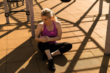 Fitness sport woman in fashion sportswear doing yoga fitness exercise in the street, outdoor sports, urban style