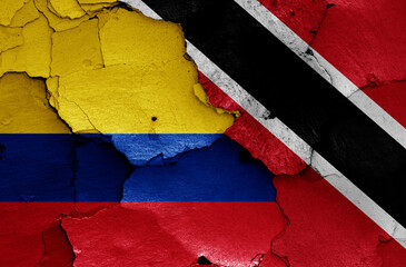 flags of Colombia and Trinidad and Tobago painted on cracked wall