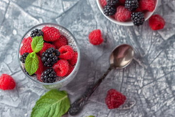 Vegan healthy food. Chia pudding with coconut milk, fresh raspberries and blackberries