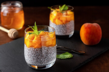 Vegan healthy food. Chia pudding with coconut milk, fresh peaches and honey
