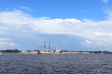 Russia, St. Petersburg, July 19, 2020. Military brig Poltava and the Peter and Paul Fortress in the water area of the Neva during the parade to the Day of the Navy