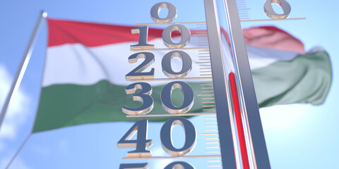 Minus 20 degrees centigrade on a thermometer measuring air temperature near flag of Hungary. Cold weather forecast related 3D rendering