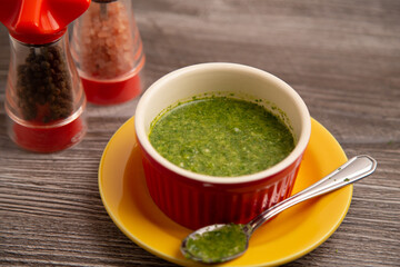 Ciliandro sauce in a red bowl