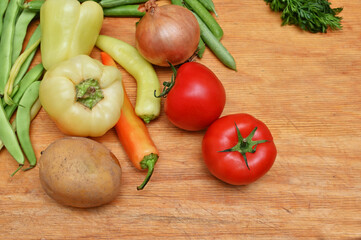 tomatos ,onion,paprika,potatos, on table 