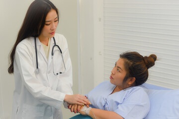 The professional psychologist female doctor consultation and touch hand with a patient in the Hospital