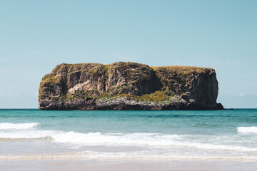 Obraz premium Lonely island in the middle of the Atlantic near Asturias, Spain