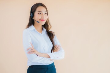 Portrait beautiful young asian business woman with headphone for call center