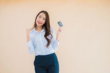 Portrait beautiful young business asian woman with phone and credit card