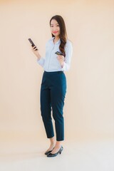 Portrait beautiful young business asian woman with phone and credit card