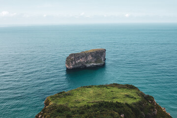 Lonely island in the middle of the Atlantic near Asturias, Spain