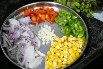 Vegetable Salad saute in Pan with Tomato Brocolli capsicum ready to be prepared for Khow Suey