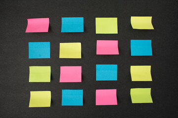 colorful sticky notes on black background