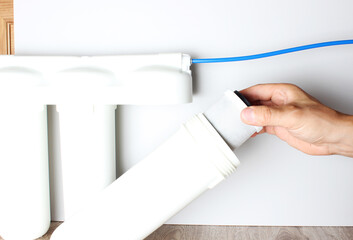 setting water filter hand flask on light background