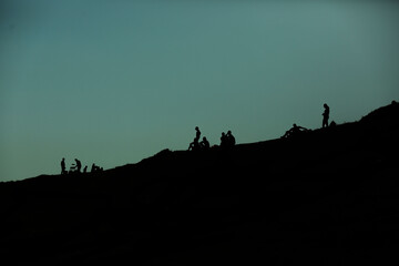 sunset, silhouette, people, sky, sunrise, sun, nature, landscape, dusk, mountain, orange, black, tree, blue, hill, night, travel, evening, silhouettes