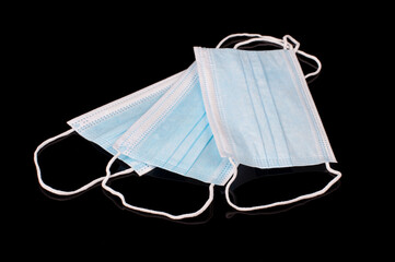 Medical facemasks isolated on the black background