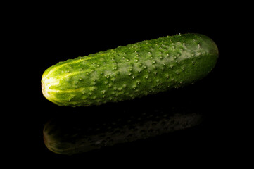 Fresh cucumber isolated on the black background